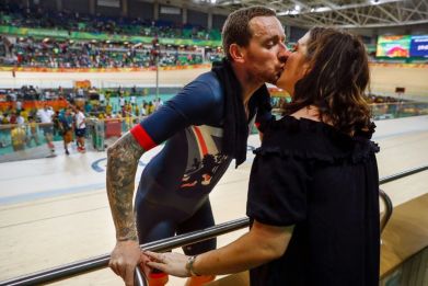 Britain's Bradley Wiggins (L) kisses his wife after winning gold at the Rio 2016 Olympic Games