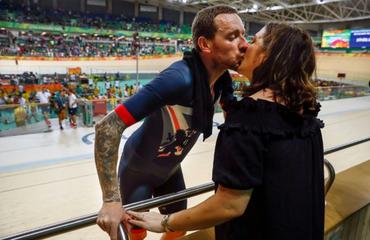 Britain's Bradley Wiggins (L) kisses his wife after winning gold at the Rio 2016 Olympic Games