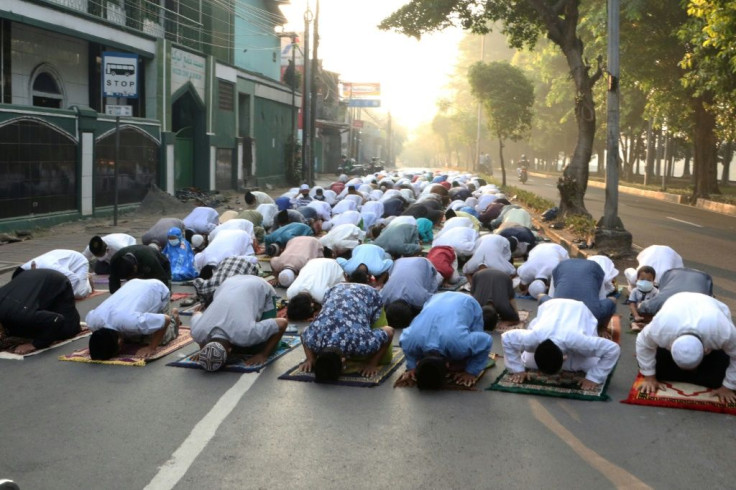 In Jakarta and elsewhere, some heeded an official request not to go inside mosques but instead gathered to pray on nearby roads