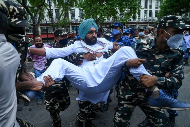 India's Congress party members were detained by security personnel as they took part in a demonstration against an alleged surveillance operation using the Pegasus spyware