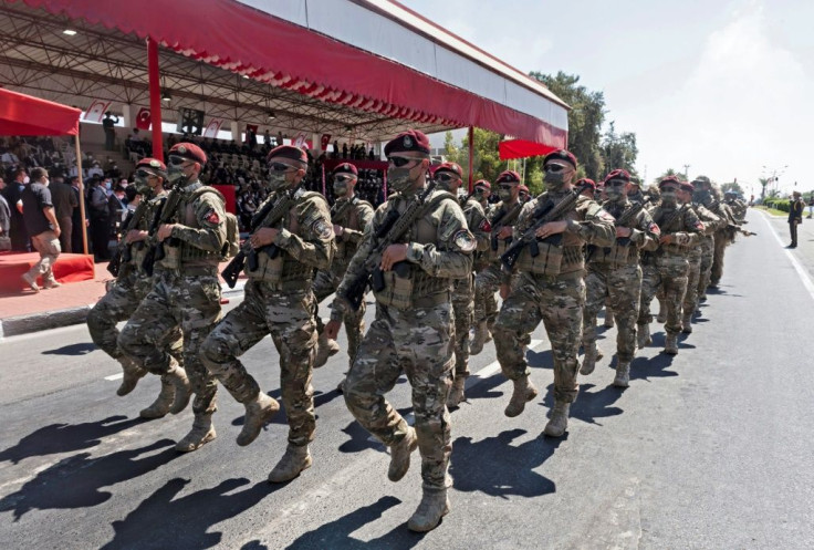 Soldiers parade in the northern part of Cyprus's divided capital Nicosia on July 20, 2021