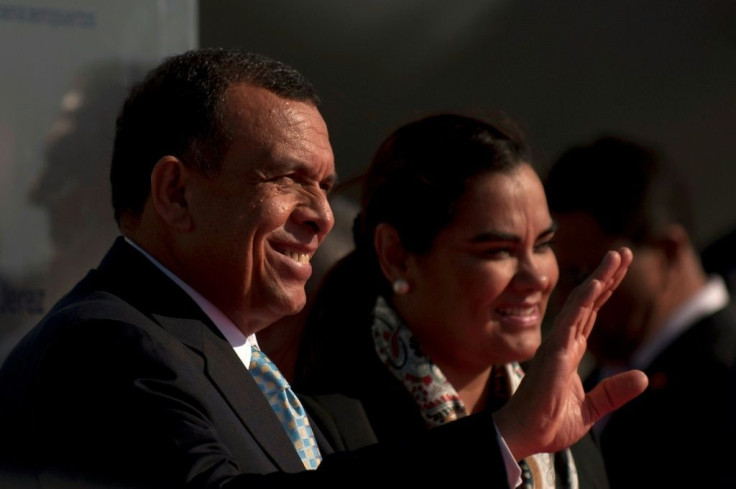 Honduras' former president Porfirio Lobo and his wife Rosa Elena Bonilla, seen in 2012, have been banned from traveling to the United States due to alleged corruption
