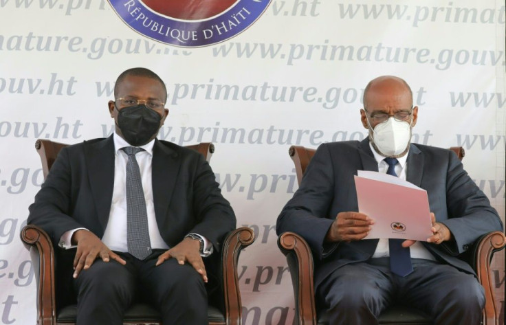 Rivals for power -- Haiti's former interim leader Claude Joseph (L) and new Prime Minister Ariel Henry in Haiti's capital Port-au-Prince as Henry and his new government are sworn in