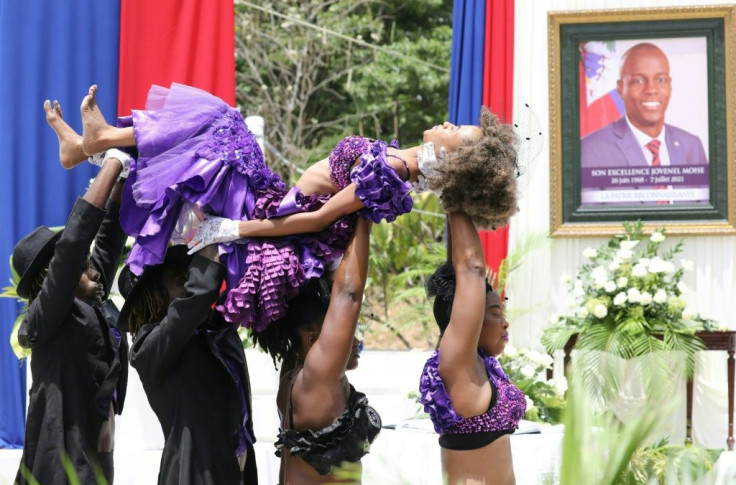 Haitian dancers perform during a ceremony in honor of murdered president Jovenel Moise