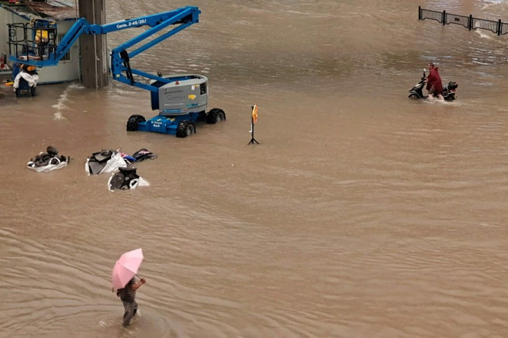 Images poured across Chinese social media showing dramatic rescues of pedestrians in Zhengzhou from torrents gushing through the streets