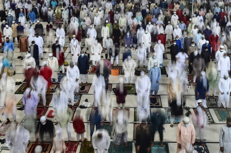 People offer prayers in Dhaka to mark the start of the Muslim festival Eid al-Adha