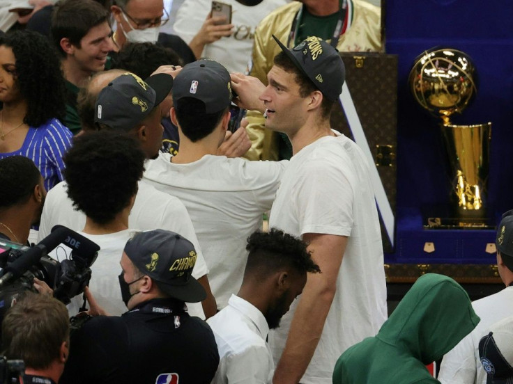 Milwaukee Bucks center Brook Lopez celebrates on the court after the club captured its first NBA title in 50 years by beating the Phoenix Suns on Tuesday
