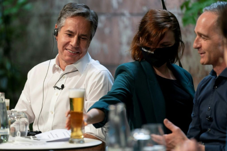 US Secretary of State Antony Blinken and German Foreign Minister Heiko Maas have a beer together in Berlin in June 2021