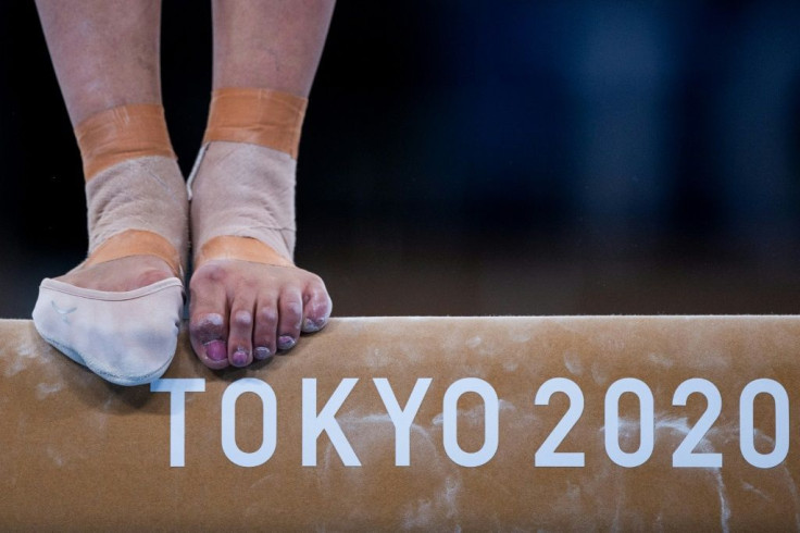 Gymnasts are in training before the start of competition on Saturday