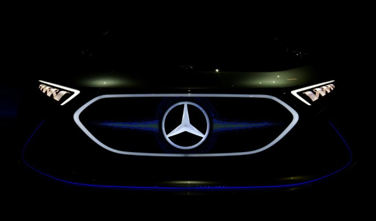 (FILES) In this file photo taken on April 05, 2018 a Mercedes logo appears on a EQA electric concept car during German luxury car manufacturer Daimler's annual general meeting in Berlin.German luxury carmaker Daimler said on July 22, 2021 it was investing