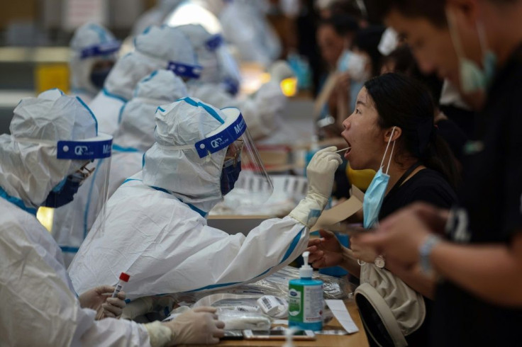 A medical worker performs a Covid test in Jiangsu province, China