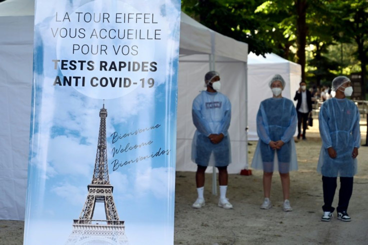 Workers at the Eiffel Tower offered Covid tests to guests in line with new rules in France