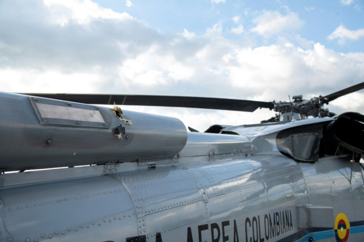 A handout picture released by the Colombian Presidency shows bullet holes in the presidential helicopter at the Camilo Daza International Airport in Cucuta, Colombia on June 25, 2021