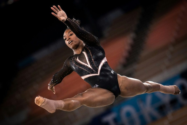Reigning Olympic gymnastics champion Simone Biles warms up for the defence of her crown in Tokyo