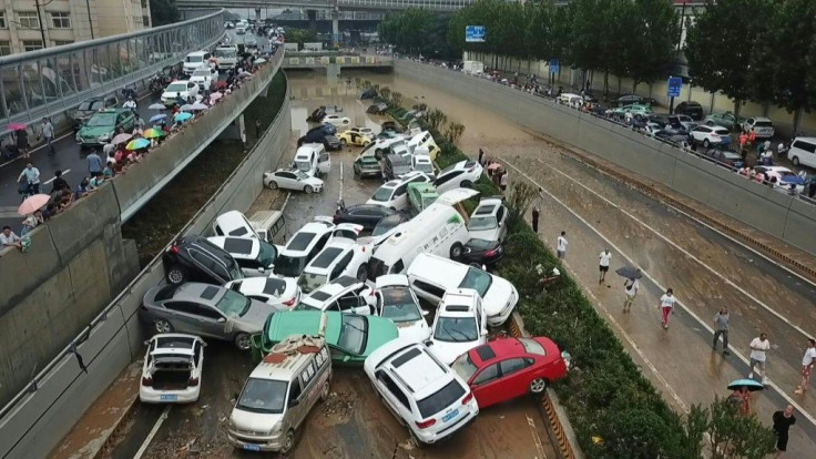 Drone images show a pile of vehicles swept away by floods, blocking a highway in central China's Zhengzhou. Torrential rains hit the city, leading to at least 25 deaths and millions of dollars in damages.