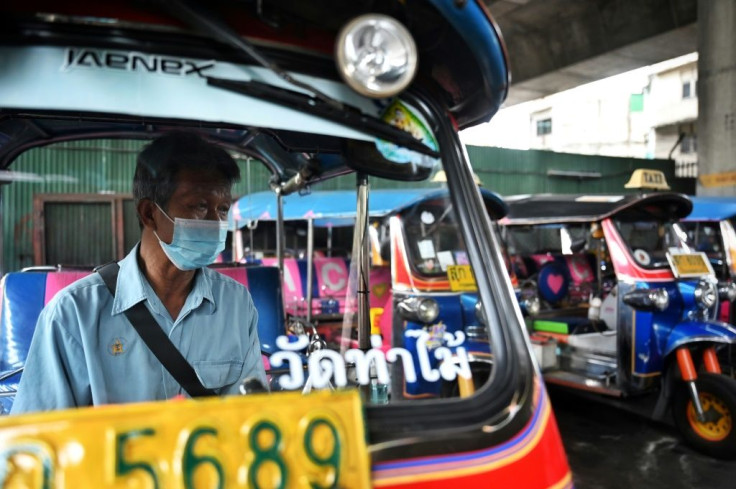 "I feel hopeless but I still have to fight for the survival of my family," says tuk-tuk driver Somsak Boontook