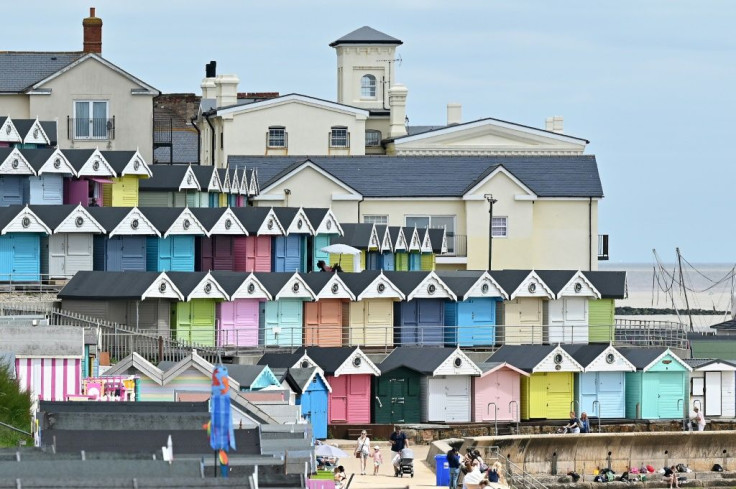 Brightly painted wooden beach huts along England's coastline have enjoyed a boom during the pandemic