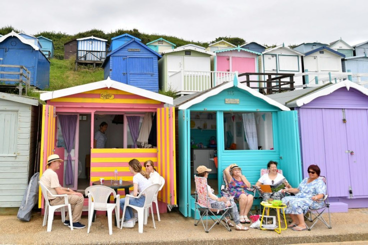 In the eastern English resort of Walton-on-the-Naze, beach huts run along the shore for miles