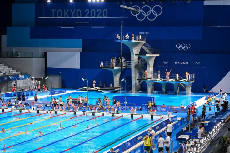 Athletes take part in a swimming training session at the Tokyo Aquatics Centre in Tokyo