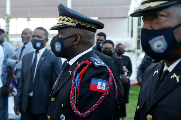 Haiti's national police chief Leon Charles (C) -- seen here at the funeral of Jovenel Moise -- was heckled by locals in Cap-Haitien who believe his force did not do enough to protect Moise