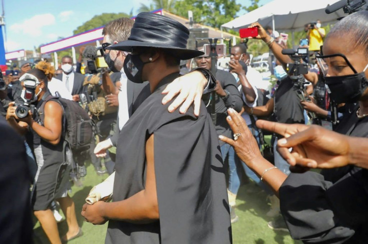 The widow of slain Haitian president Jovenel Moise, Martine (C), wore a mask bearing his photo at his funeral