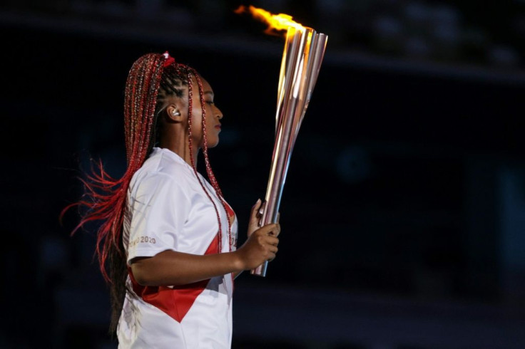 Japanese-Haitian tennis star Naomi Osaka lit the Olympic cauldron in the crowning moment of the opening ceremony