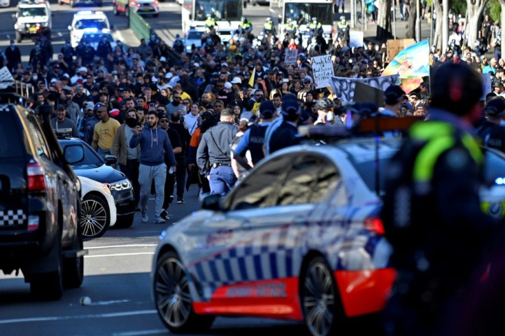 Police block the way to marching protesters in Sydney