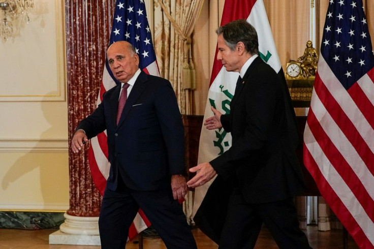 US Secretary of State Antony Blinken (R) and Iraqi Foreign Minister Fuad Hussein are pictured together after a press conference at the US State Department on Friday