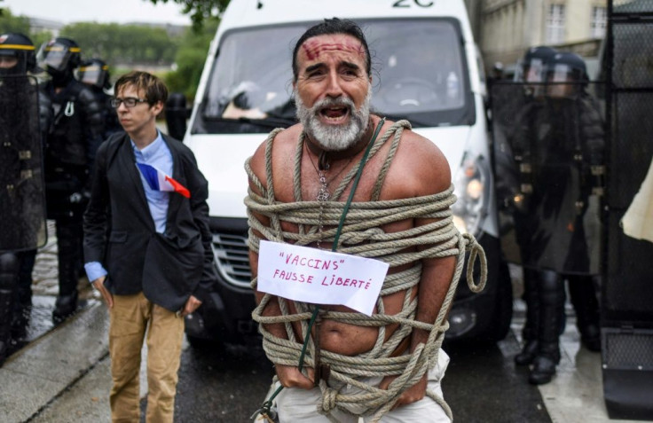 One protester sported a placard reading "vaccines: fake freedom"