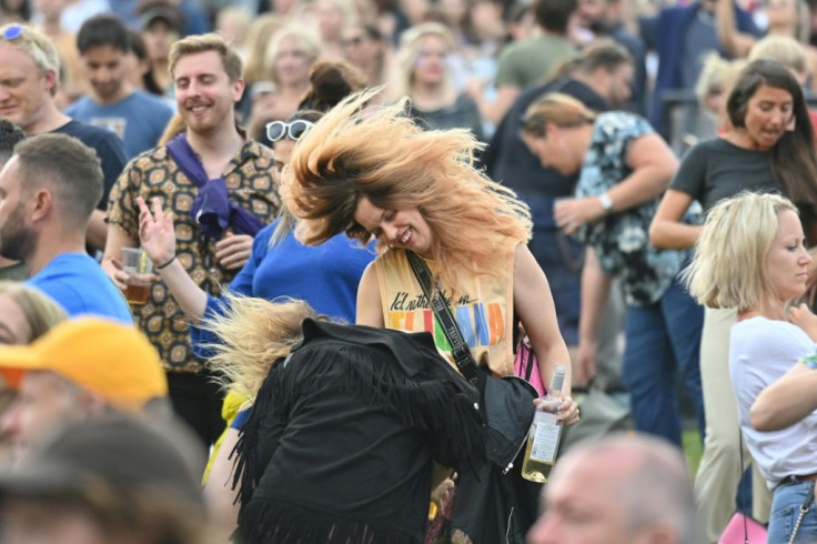 Families mingled with extravagantly-dressed ravers, united in anticipation for the return of music on the stage