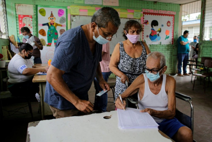A man checks his identification on the voting list during the citizen verification process in Managua, Nicaragua