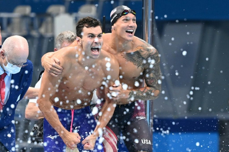 Caeleb Dressel (right) and Blake Pieroni celebrate victory for the United States in the 4x100m freestyle relay