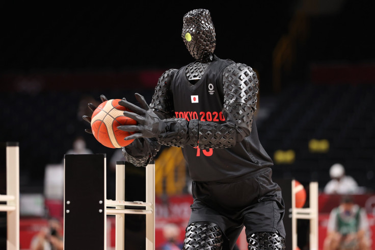A robot plays basketball during halftime of the Men's Preliminary Round Group B game between the United States and France 