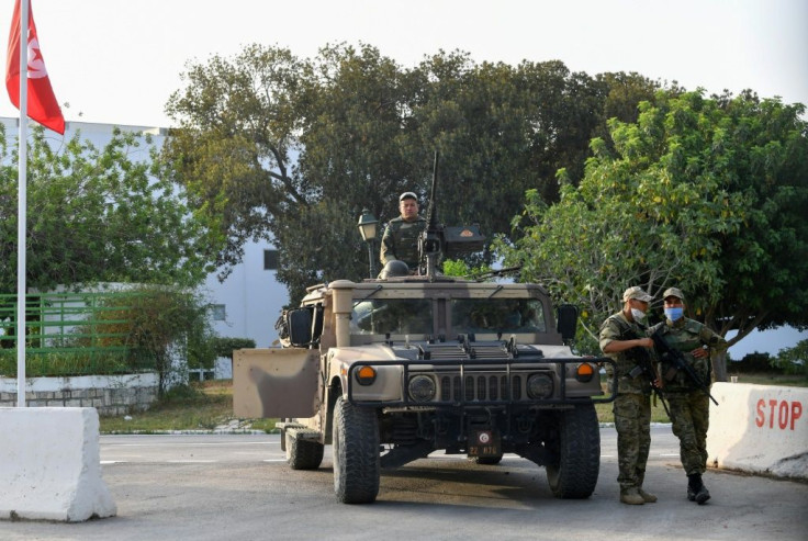 Tunisian soldiers cordon-off parliament in the capital Tunis on Monday, following the president's dismissal of the prime minister and suspension of parliament