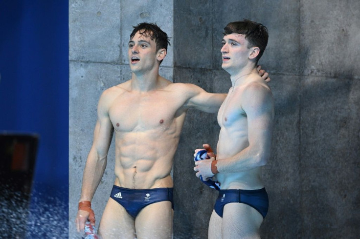 Britain's Tom Daley (left) and Matty Lee react after winning Olympic diving gold in Tokyo