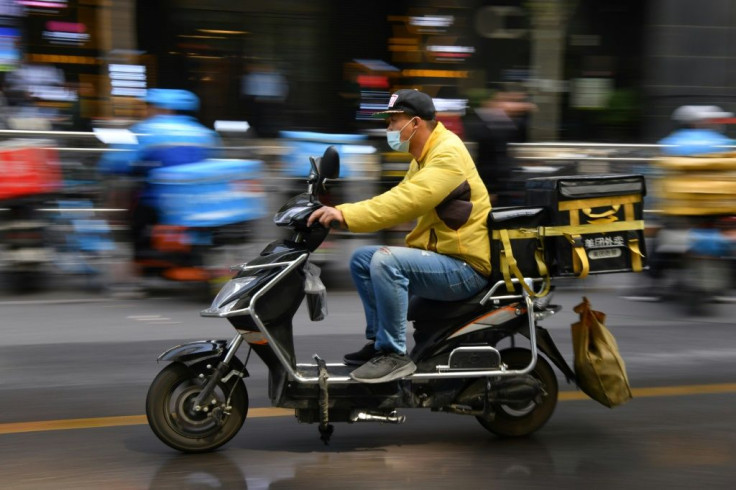 Shares in China's food delivery giant Meituan plunged 14 percent after new rules were issued to protect hard-pressed drivers