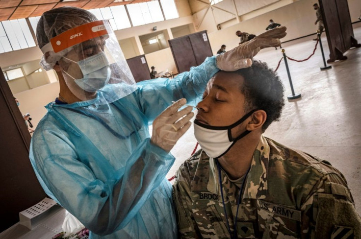 A US army soldier is tested for Covid-19 upon arrival at Morocco's Agadir military airport in June 2021 amid ongoing restrictions on travel due to the pandemic
