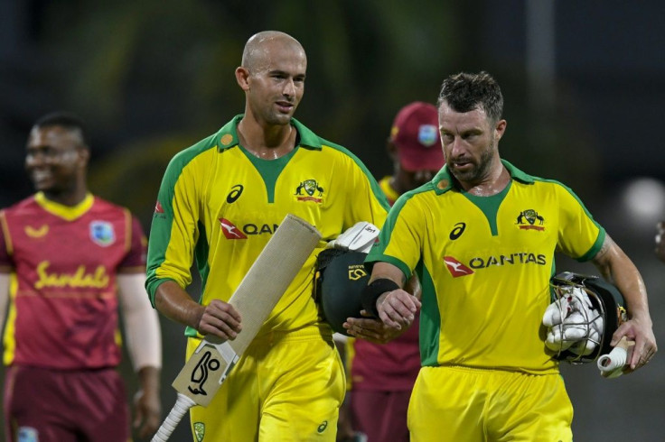 Ashton Agar (left) and Matthew Wade of Australia chat after winning the 3rd and final ODI between West Indies and Australia at Kensington Oval, Bridgetown, Barbados