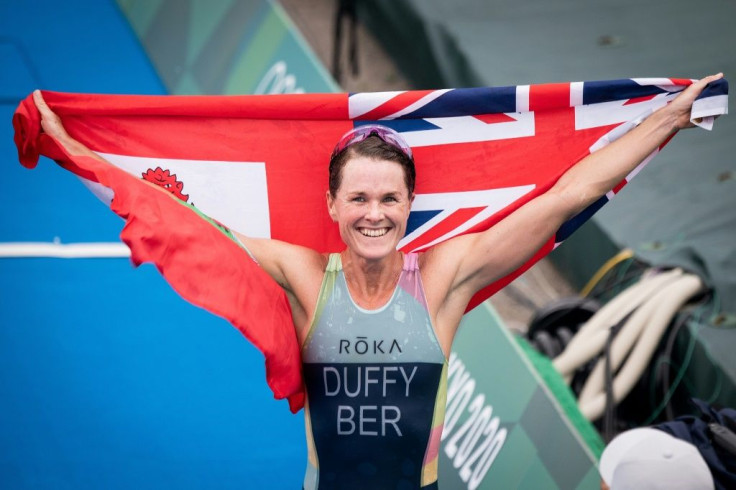 Triathlete Flora Duffy celebrates after winning Bermuda's first-ever Olympic gold