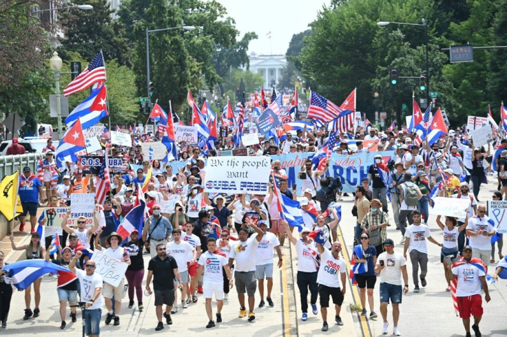Demonstrators marching against and in favor of the Cuban government took to the streets around the world on the weekend