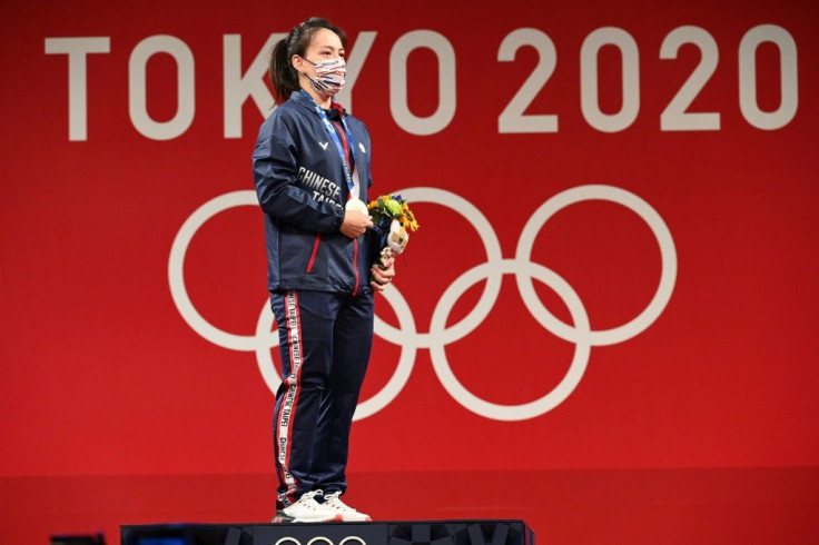 Taiwan's star weightlifter Kuo Hsing-chun won gold at the Tokyo Olympics, but there was no flag and no anthem to greet her