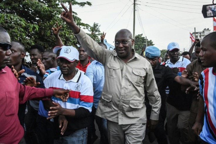 Mbowe, centre,was detained with 15 other party members in a late-night crackdown last week