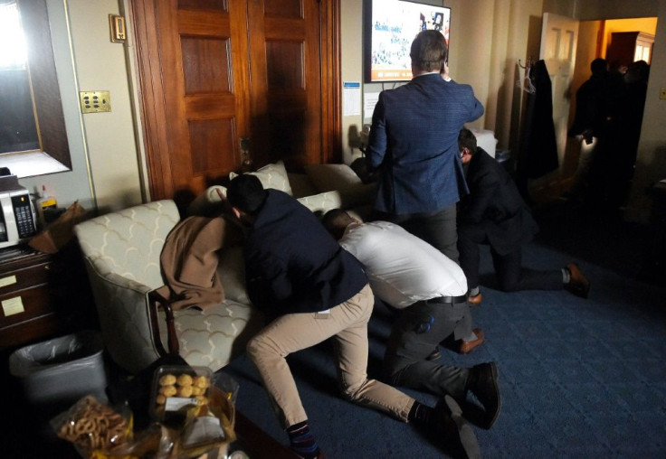 Congress staffers barricade themselves after Trump supporters stormed inside the US Capitol in Washington, DC on January 6, 2021