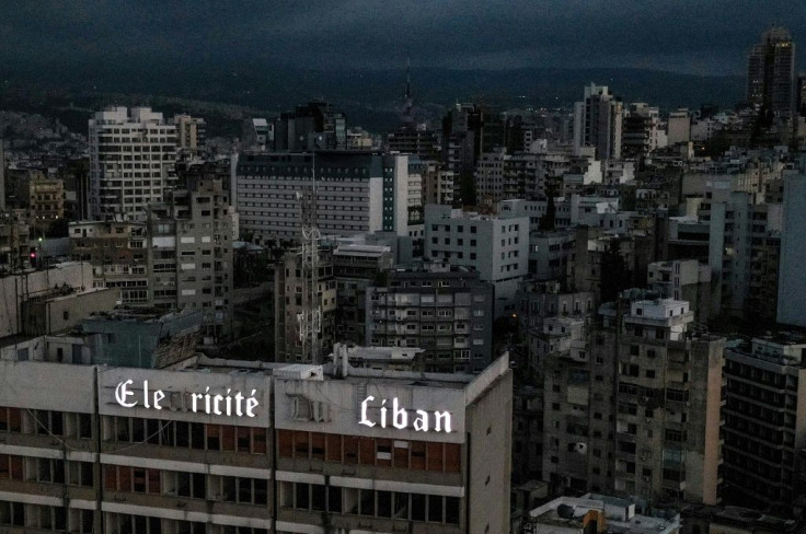 Darkness shrouds the Lebanese capital Beirut around the headquarters of the state electrity utility during one of the ever lengthening daily power blackouts