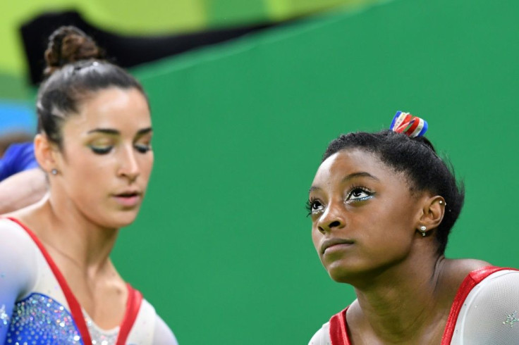 Aly Raisman (L, pictured at the Rio Olympics) was among many who offered support to US gymnast Simone Biles after she withdrew from the women's team event at the Tokyo Olympics, citing mental health concerns