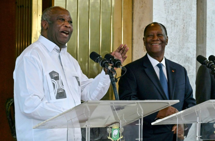 Ivory Coast President Alassane Ouattara (R) and his predecessor and former rival Laurent Gbagbo (L) met for the first time since the crisis