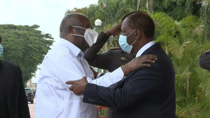 Ivory Coast President Alassane Ouattara offers a hearty welcome to his predecessor Laurent Gbagbo as the rivals meet for the first time since the West African country's deadly 2010-11 conflict