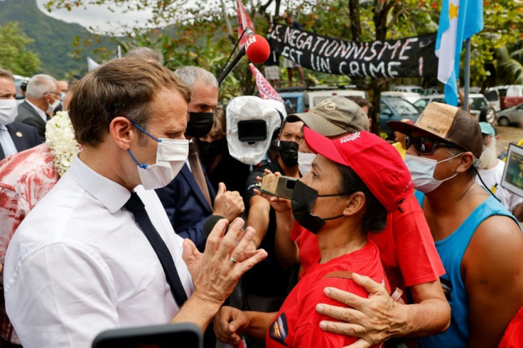 French President Emmanuel Macron stopped by the side of the road to talk to anti-nuclear protestors in French Polynesia