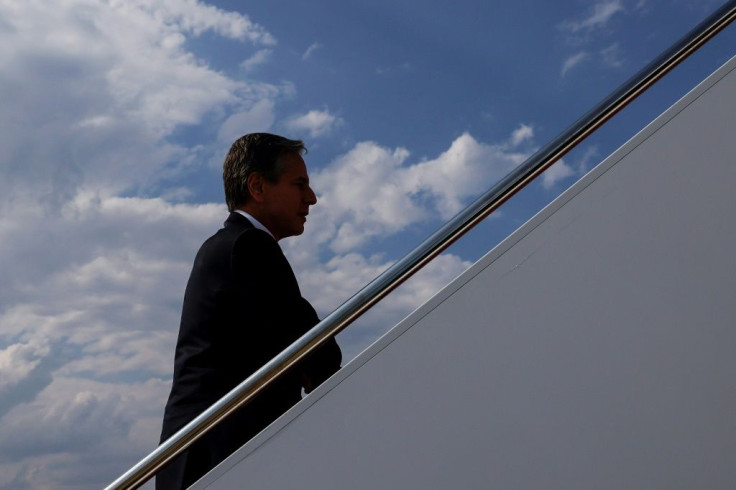 US Secretary of State Antony Blinken boards an aircraft as he departs for New Delhi, India and Kuwait. Blinken said Afghanistan would become a 'pariah state' if the Taliban take control by force