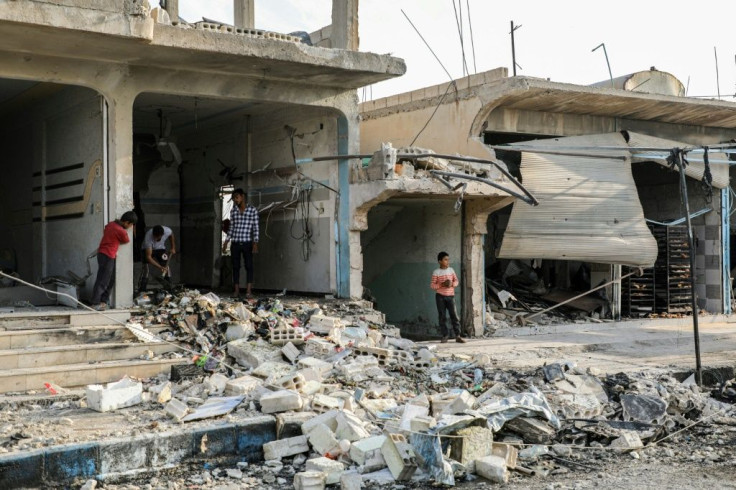 Rubble in a street at the scene of an explosion aimed at Ahrar al-Sharqiya rebels in the Syrian town of Suluk near the Turkish border in October 2019